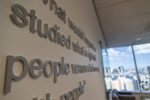 A close up photo of wall mounted 3D acrylic lettering.