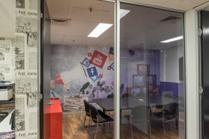 Digitally printed removable self-adhesive wall fabric on an office wall