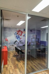 Digitally printed removable self-adhesive wall fabric on an office wall