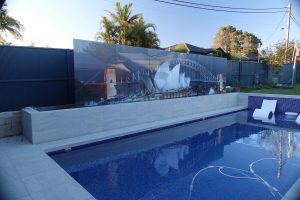 Pool with a 7m wide custom glass digitally printed pool fence 
